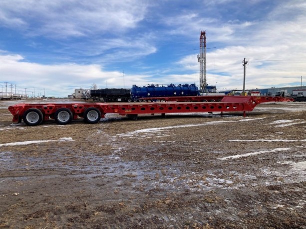 2006-peerless-70-ton-58ft-long-24-wheel-folding-scissor-neck-oil-field-trailer-big-1