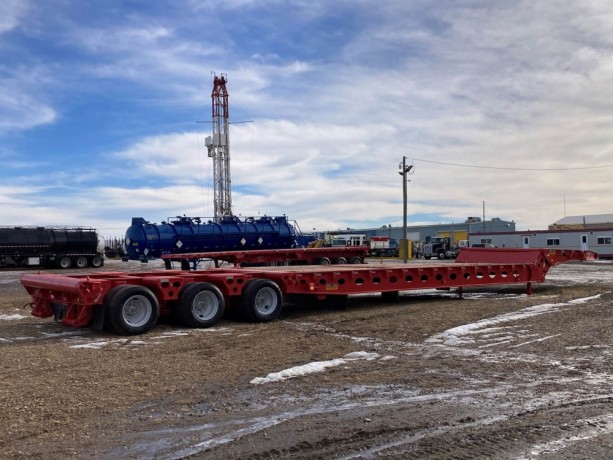 2006-peerless-70-ton-58ft-long-24-wheel-folding-scissor-neck-oil-field-trailer-big-2